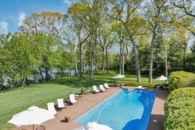 Beautiful pool on stunning estate grounds .