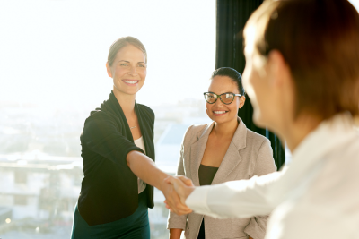 woman shaking someone's hand