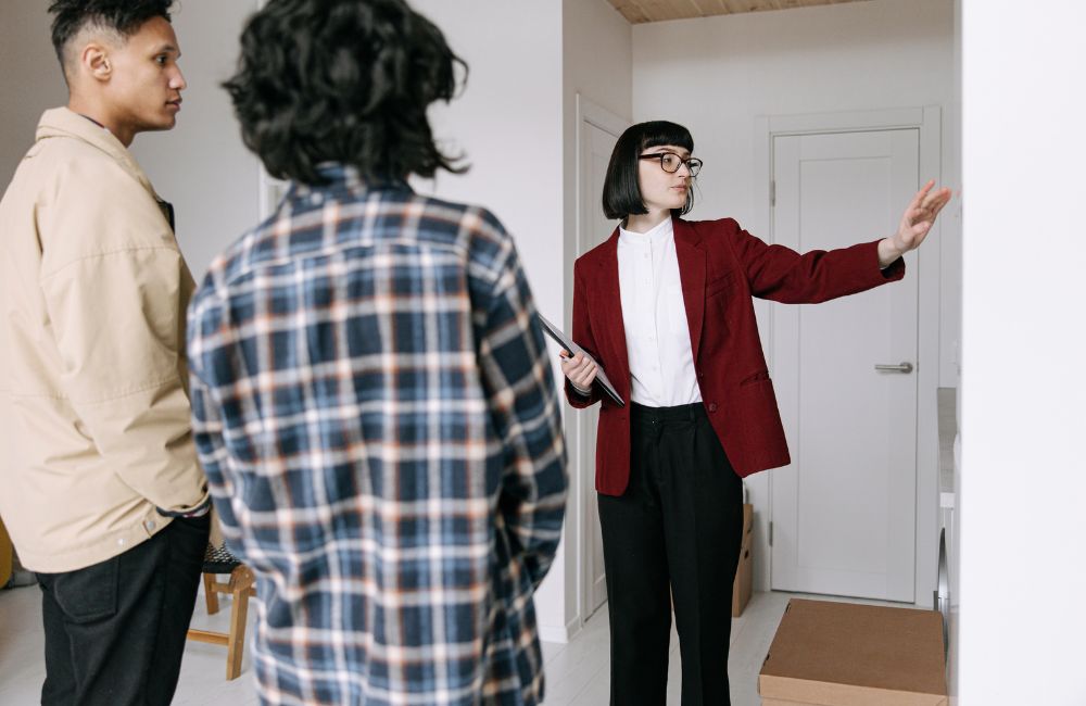 Real estate agent assisting military family with home search