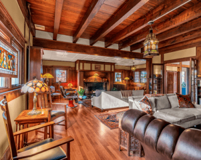 Living room with wood paneling and fireplace