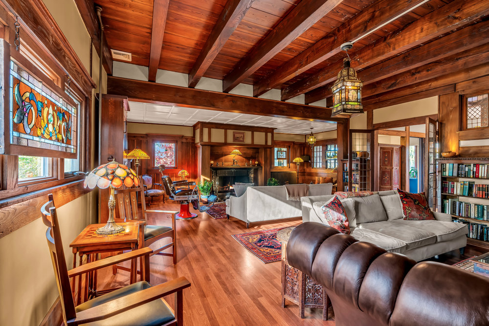 wood paneled living room with fireplace